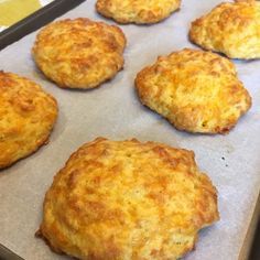 six biscuits on a baking sheet ready to be baked