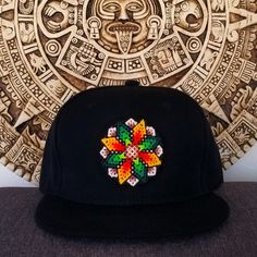 WIKIARI Cap. Huichol Handcrafted Cap "Nice stay" Unique and exclusive designs of WIKIARI, handmade by our Wixárika artisans. Available in: -Flat Cap (Snapback) -Curved Cap(Baseball Cap) SHIPPING INCLUDED!...  FREE SHIPPING! We are WIKIARI Wixárika Design a social company, 100% Mexican connected with Huichol art focused on the dissemination and design of unique pieces of Wixárika art in Mexico. We are WIKIARI Diseño Wixárika a social company, 100% Mexican connected with Huichol art focused on the spread and design of unique pieces of Wixárika art in Mexico. Traditional Black Hat As Gift, Casual Handmade Snapback Hat, Multicolor Snapback Hat One Size Fits Most, Adjustable Artisan Hat As A Gift, Artisan Adjustable Hat As A Gift, Artisan Adjustable Hat As Gift, Multicolor Adjustable Flat Brim Hat, Handmade Flat Brim Hat As Gift, Adjustable Multicolor Flat Brim Fitted Hat