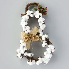 a wreath made out of cotton and twine