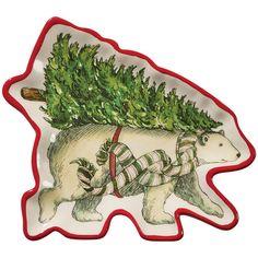 a bear carrying a christmas tree on its back