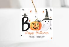 a halloween gift tag hanging from a string