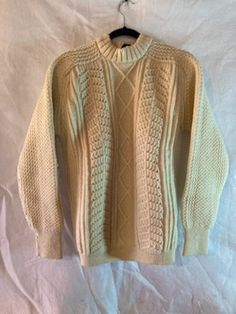 A great Irish wool Al Baskin of Joliet il/Oak Brook Il sweater in size 46. Cream-colored and in great condition. It screams a mug of cocoa, jeans, and boots next to the campfire! Thanks for looking and please come back often as we are always adding inventory! Irish Sweater, Irish Fashion, Pullover Outfit, Please Come Back, Campfire, Sweater Outfits, Knit Sweater, Knitted Sweaters, Gender Neutral