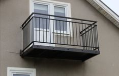 an apartment building with a balcony and balconies