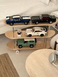 a skateboard shelf with toy cars on it