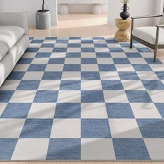 a blue and white checkered rug in a living room