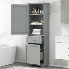 a white bath tub sitting next to a gray cabinet