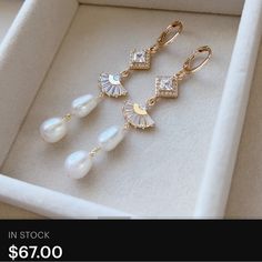 three pairs of pearl and crystal earrings in a white box with the words, $ 6 00