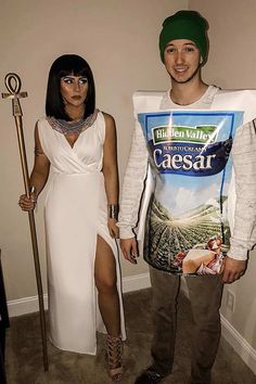 a man and woman in costume standing next to each other with an odd shirt on