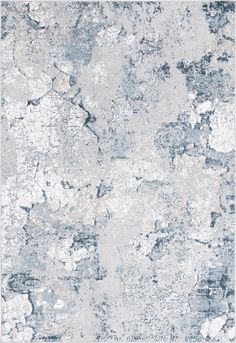 an abstract gray and white rug with lots of paint on the floor, it is very soft