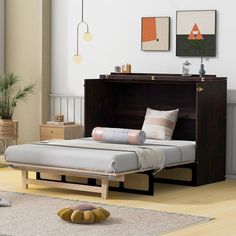 a bed sitting on top of a hard wood floor