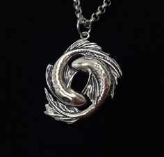 This is Koi Fish Yin Yang themed Necklace. It is entirely handmade in Gudbrand's workshop. Made with care, this high-quality pendant will get you many compliments -------------- DIMENSIONS AND INFO -------------- The height of the pendant is 1.37 inches / 35mm The width of the pendant is 1 inch / 25mm The brass pendant comes with 22-inch long bronze colored chain. The Silver pendant comes with 22-inch long stainless steel chain. -------------- OPTIONAL GIFT PACKAGE -------------- It is also poss Koi Fish Necklace, Koi Fish Jewelry, Koi Necklace, Koi Fish Yin Yang, Fish Yin Yang, Fish Accessories, Yin Yang Jewelry, Yin Yang Necklace, Fish Jewelry