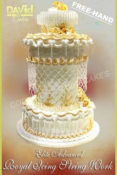 the cake is decorated with gold and white icing