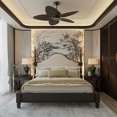 a large bed sitting under a ceiling fan in a bedroom next to a wall mounted painting