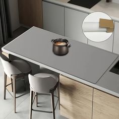 a kitchen table with two stools and a pot on the counter top in front of it