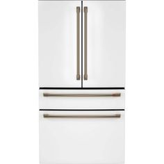 a white refrigerator freezer sitting inside of a kitchen cabinet with two doors on each side