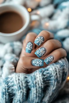 Embrace the cool elegance of Artistic Wonderland Nails with a soft blue base that evokes the serene beauty of winter skies and seas. Detailed white snowflakes in varying sizes create a dynamic, festive look, while a touch of shimmering glitter adds an enchanting sparkle to these Christmas nails. Perfect for the holiday season, this design exudes both sophistication and holiday cheer.  Hashtags: #ArtisticWonderlandNails #ChristmasNails #WinterNailArt #SnowflakeNails #BlueNailDesign #HolidayNails #ElegantNailArt #ShimmerNails #FestiveNailDesign Ombre Snowflake Nails, Holiday Nails Winter Christmas, Nails Winter Christmas, Wonderland Nails, Nails Sparkling, Sky And Ocean, Winter Skies, Holiday Nails Winter, Festive Nail Designs