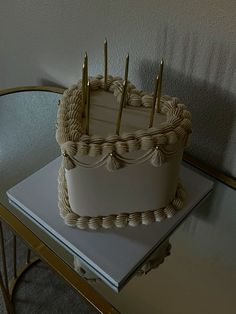 a white cake sitting on top of a table