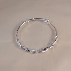 Beautiful Sterling Silver Adjustable Bracelet. Textured And Smooth Twist Pattern. 2 1/2" In Diameter And 8" Circumference. Cheap Elegant Metal Heart Bracelet, Aesthetic Silver Bracelet, Silver Adjustable Flexible Bangle, Adjustable Flexible Silver Bangle, Adjustable Silver Round Stretch Bracelet, Silver Adjustable Stretch Bracelet, Adjustable Silver Stretch Bracelet, Bangles Jewelry Designs Silver, Silver Bangles Design