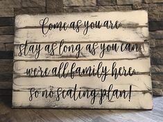 a wooden sign that says come as you are, stay as long as you can