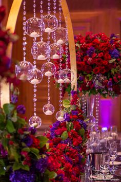 the table is set up with flowers and wine glasses for an elegant wedding or reception