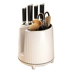 a kitchen utensil holder with knives and spoons in it on a white background