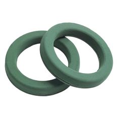 two green rubber o - rings on a white background