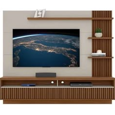 an image of the earth taken from space on a wall mounted tv unit with shelves