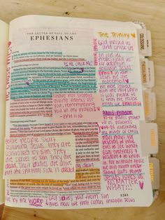 an open bible with the words ephesians written in different colors and sizes on it