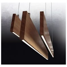 three wooden lights hanging from the ceiling