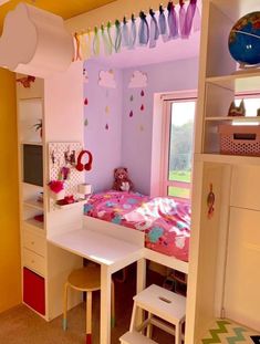 a child's bedroom with pink walls and furniture