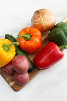 several different types of vegetables on a cutting board