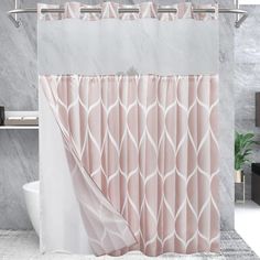 the shower curtain is pink and white with an abstract design on it, along with a bathtub