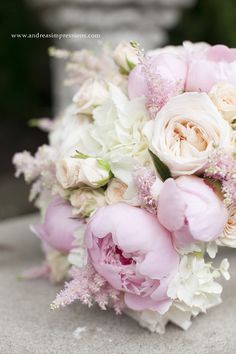 a bridal bouquet with pink and white flowers