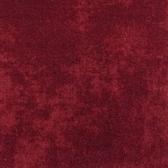 a close up view of a red velvet textured material background or wallpaper pattern