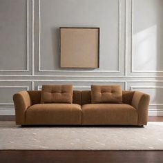 a living room scene with focus on the couch and rug in front of the wall