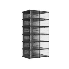 a black and white photo of a shelf with drawers on each side that has writing on the bottom