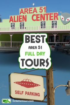 there is a sign that says best area 51 full day tours in front of an alien center