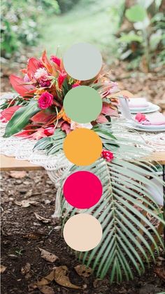 a table with flowers and plates on it in the middle of some leaves, grass and dirt