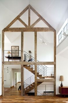 the inside of a house with stairs and railings