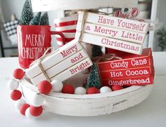 a basket filled with red and white christmas candy