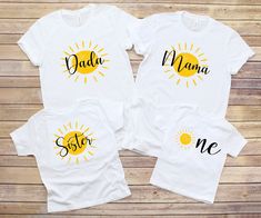 two matching shirts with the words daddy, mama and me printed on them in black ink