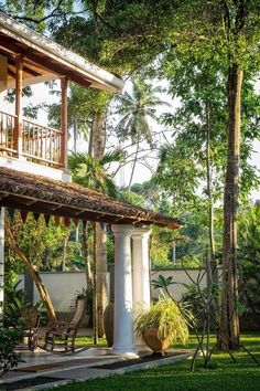 an outside view of a house with trees in the background