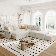 a living room filled with furniture and lots of windows