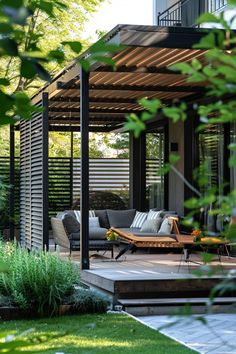 an outdoor living area with furniture and plants