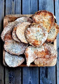 some bread is sitting on a cutting board and ready to be cooked in the oven