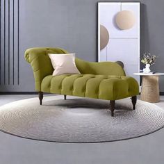 a green couch sitting on top of a white rug