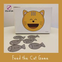 a box with some cut outs in front of it that says feed the cat game