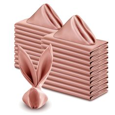 a stack of pink napkins with bunny ears on top