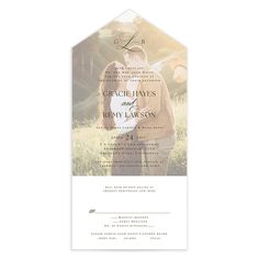 a wedding card with an image of two people kissing in the middle of a field