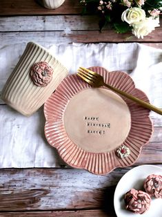 a pink plate with some cookies on it